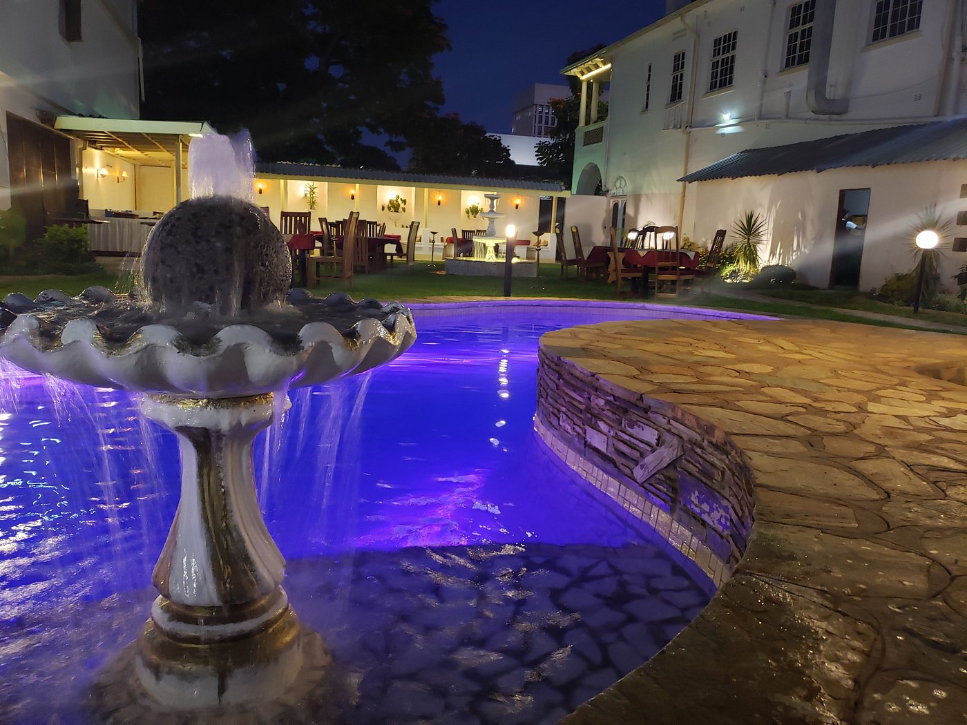 Selborne pool and fountain illuminated in the evening